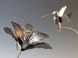 Maybe you would like to learn more about one of these? Hummingbird And Lily Flower Metal Sculpture By Natureofsteel Metal Sculpture Lily Flower Metal Flowers