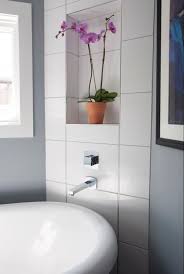 The vertical wall section of the profile provides a decorative finish and protects adjacent tiles. Schluter Profiles Schluter Shower System Schluter Ditra Westside Tile And Stone