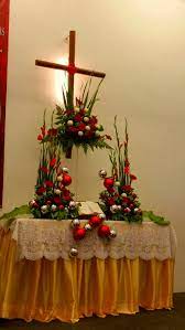 Church font and window decorated with silvery pine cones and. Pin On Emclc Church Altar Flower Arrangements