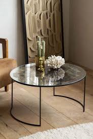 Good condition and looks great in any living room. Vintaged Glass Mirror Iron Round Coffee Table Rockett St George