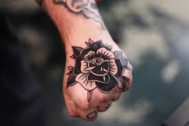 Black Traditional Rose Tattoo On The Hand Hand Tattoos Rose Hand Tattoo Traditional Rose Tattoos