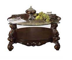 The open look design is charmingly coated in a dark cherry finish to accentuate the irregular shape and sturdy wood construction. Acme Versailles Glass Top Coffee Table In Cherry 82080