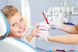 Happy Child With Toy Dentures Pediatric Dentist Emergency Dentist Pediatric Dentistry