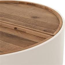Zuchi coffee table in high gloss finish with metal slice effect $349 this uniquely design coffee table demands attention. Cecile Modern Classic Round Drum Oak Wood Cream Storage Coffee Table 41 W 50 W Kathy Kuo Home