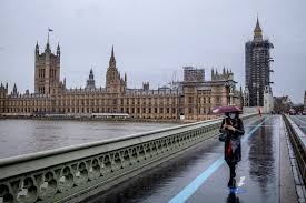 A woman jogging near city hall, london, the day after prime minister boris johnson put the uk london's carnaby street empty as shops closed after a lockdown was announced in the latest bid to stop the spread of coronavirus through the uk. U K Imposes Harsher Lockdown On London Citing New Version Of Virus The New York Times