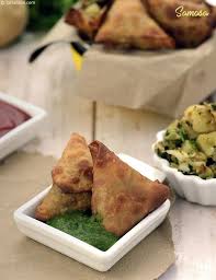 Unlike Other Samosas The Gujarati Version Does Not Use Boiled Potatoes Here Raw Potatoes Are Chopped And Allowed To Co Samosa Recipe Recipes Gujarati Recipes