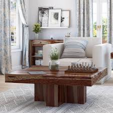 Each round end table stands on three genuine horn legs. Dallas Midnight Solid Wood Square Pedestal Rustic Coffee Table