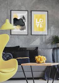 The coal gray color scheme creates the modern and bold appearance of this classy and chic living room, while the pops of pastel yellow soothe the dark ambiance and bring lively and cheery feel in the interior. Gray And Yellow Living Room Hambedo