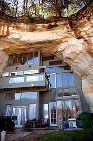 A Modern Metal House Built Into A Rock Cave Ampitheater Materials And Spaces Juxtaposed Architecture Architecture Design Modern Architecture