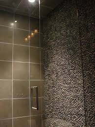 Low cost sloped or angled wall shower rod solution angled wall mount to be used with any shower curtain rod. Standing Pebble Tiles Add Texture To Your Shower Walls Decor Report