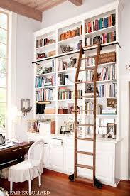 Combine open shelves with closed ones for an organized approach. Library Bookcases With Ladders Library Ladder Home Library Design Home Library