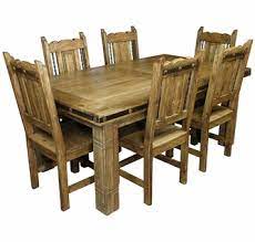 Arranging a dining room can be as simple as having a table and chairs. Mexican Iron Banded Southwest Dining Set 7 Piece
