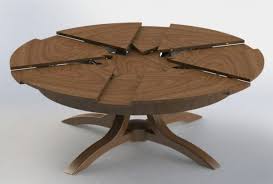 Solid walnut round arts and crafts expandable dining room. La Table Ronde Extensible Idees Pratiques Pour Votre Ameublement Archzine Fr Dining Table Round Extendable Dining Table Expandable Round Dining Table