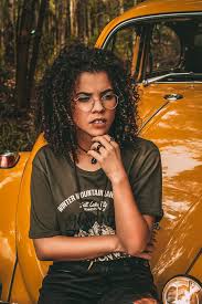 Short curly hairstyles work well with cat eye frames. Hd Wallpaper Women With Glasses Curly Hair Dark Hair Looking Away Mode Of Transportation Wallpaper Flare
