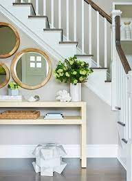 Maybe you would like to learn more about one of these? Staggered Mirrors Over Gold Raffia Console Table Transitional Entrance Foyer