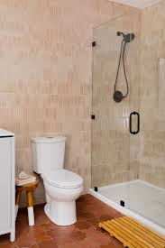 For a beautiful replication of classic italian marble, choose this pearl glazed porcelain floor and wall tile from the sovereign stone collection. Love This Wall Tile Pattern It S Called A Vertical Broken Joint And We Love How It Highlights The Va Shower Tile Brown Tile Bathroom Brown Tile Floor Bathroom