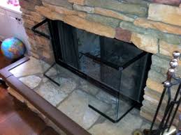 If you find that you've taken a little too long between cleanings and the soot has baked on there pretty well, try using a razor blade to scrape the stubborn bits of. How To Clean Glass Fireplace Doors In A Few Easy Steps