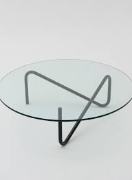 A living room coffee table is usually placed directly in front of a couch, so the size of the table will be relative to the seating. Tricom Round Glass Coffee Table Metal Furniture Coffee Table Design