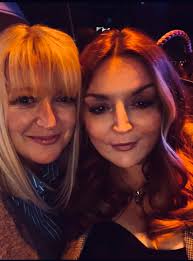 What is a good location to stand to get pictures of the entire Eiffel Tower  in the background in Paris?