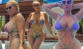 Coco Austin, 44, puts on VERY busty display in a string bikini | Daily Mail  Online