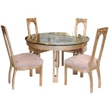 This dining table comfortably seats four, and pairs well with chairs having an 18 to 19 seat height. 1960s Glazed Silver Leaf Round Dining Table And Four Chair Set By James Mont At 1stdibs