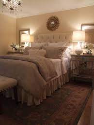 Restful Beige Bedroom With Mirrored Night Tables And Tufted Fabric Headboard Home Bedroom Bedroom Design Home