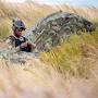 Profile Picture of U.S. Navy Seaman Terrence Dickens fixes tents in a beachside dune ...on Google