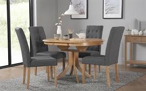 Outfitted with beautiful walnut or ash legs, a from prominently recognized italian designer, connubia, the giove round extending table features a simple extension to turn this circular design. Round Oak Extending Dining Table And Chairs Off 58