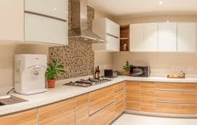 If you are going for machine made modular cabinets, plywood with both sides laminated and each panel duly edge banded is the better option. Learn About Different Materials For Kitchen Cabinets To Find The One That Suits Your Needs