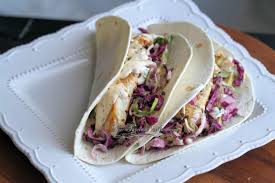 Spread the tortillas with a little spicy mayo, then place the salad and fish down the centre. Grilled Fish Soft Tacos With Baja Cream Sauce