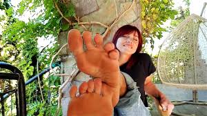 R0edheaded babe shows you her feet so close that you can sniff and lick the