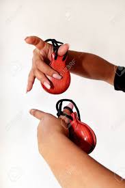 Moreover, the items to be counted (three bells, six castanets) are often difficult to discern within the scenes, diminishing the title's serviceability as a counting book. Spanish Castanets In The Hands On White Background Close Up Percussion Instrument Used In Flamenco Sevillanas Dance In Spain Isolated Close Up Hands Detail Of Flamenco Dancer With Castanets Stock Photo Picture