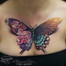 Stunning Butterfly Tattoo On Chest By Levgen Feminine Tattoos Unique Tattoo Designs Butterfly Tattoo
