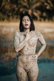 Sensual naked Asian woman touching chest near pond · Free Stock Photo