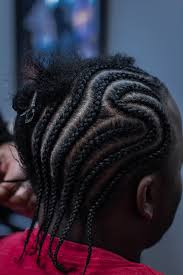 African cornrows with long twist braids. Hair Braiding Regal Barber Co