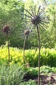 Steel Garden Or Yard Outside And Outdoor Sculpture By Artist Titled Seed Head Giant Metal Heads Statues Sculptures A Garden Art Metal Garden Art Garden Art Diy