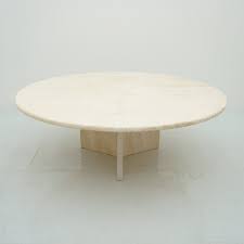 This coffee table is hand chiseled and sculpted by artisans from a natural stone from a desert. Round Coffee Table In Italian Travertine Stone 1970s 167287