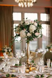 Making a tall glass vase wedding arrangement with fresh hydrangeas. Pink Blush And Gold Tall Wedding Centerpiece Vegas Flowers Delivery