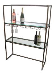 This wall mounted shelving system is combination of toughened safety glass with steel wire or rope and brass supports. Backbar Racks Bar Fittings