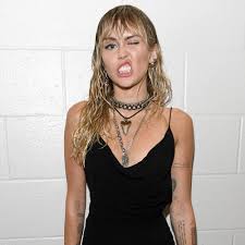 Miley got her first tat at the youthful age of 17. Miley Cyrus Debuts Two New Tattoos At 2019 Mtv Vmas Photos Allure