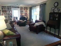 Auburn hills living room set beige supple leather sectional with convenient console, accented with brown and gray pillows, brown leather ottoman and a gray rug. Mixing Leather Colors In Small Living Room