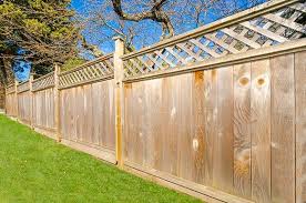 Professional fence painting job showing even coat and wood texture