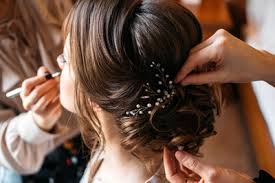 This top knot hairstyle is perfect for guests attending a summer wedding. The Ultimate Hairstyle Guide For Good Wedding Guest Etiquette John Frieda