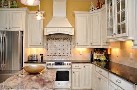 White Cabinets Dark Granite Stainless Steel Appliances Custom Tile Backslash Yel Retro Kitchen Appliances New Kitchen Cabinets Stainless Appliances Kitchen