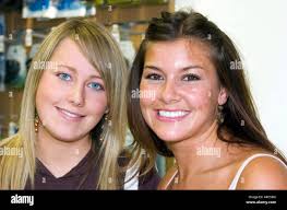 Former Big Brother 7 housemate Imogen Thomas holding mobile phones as she  returns to her home town of Llanelli, Wales, UK Stock Photo