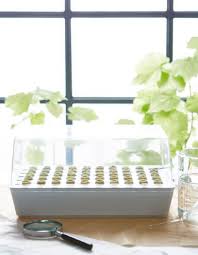 A Vaxer Nursery Sits On A Table With Plants In Front Of A Window Ikea Diy Ikea Home Furnishings