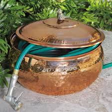 A decorative bronze garden hose wheel >> check price on amazon << if you are looking for a stylish hose reel to give your garden some character, then this bronze reel is going to be ideal. 26 Best Garden Hose Storage Ideas Hose Storage Garden Hose Storage Garden Hose