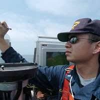 Officer of the Deck Lt.j.g. Neil Cayabyab logs the current heading of the  Ohio-class fleet ballistic missile submarine USS Alabama (SSBN 731) using a  grease pencil