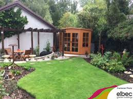 A Lovely Shire Hampton Corner Summerhouse Treated To Show Off The Natural Wood And Tucked Neatly Away In The Corner O Summer House Natural Wood Outdoor Decor