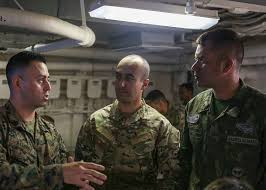 U.S. Marine Gunnery Sgt. David Ramirez, left, the civil